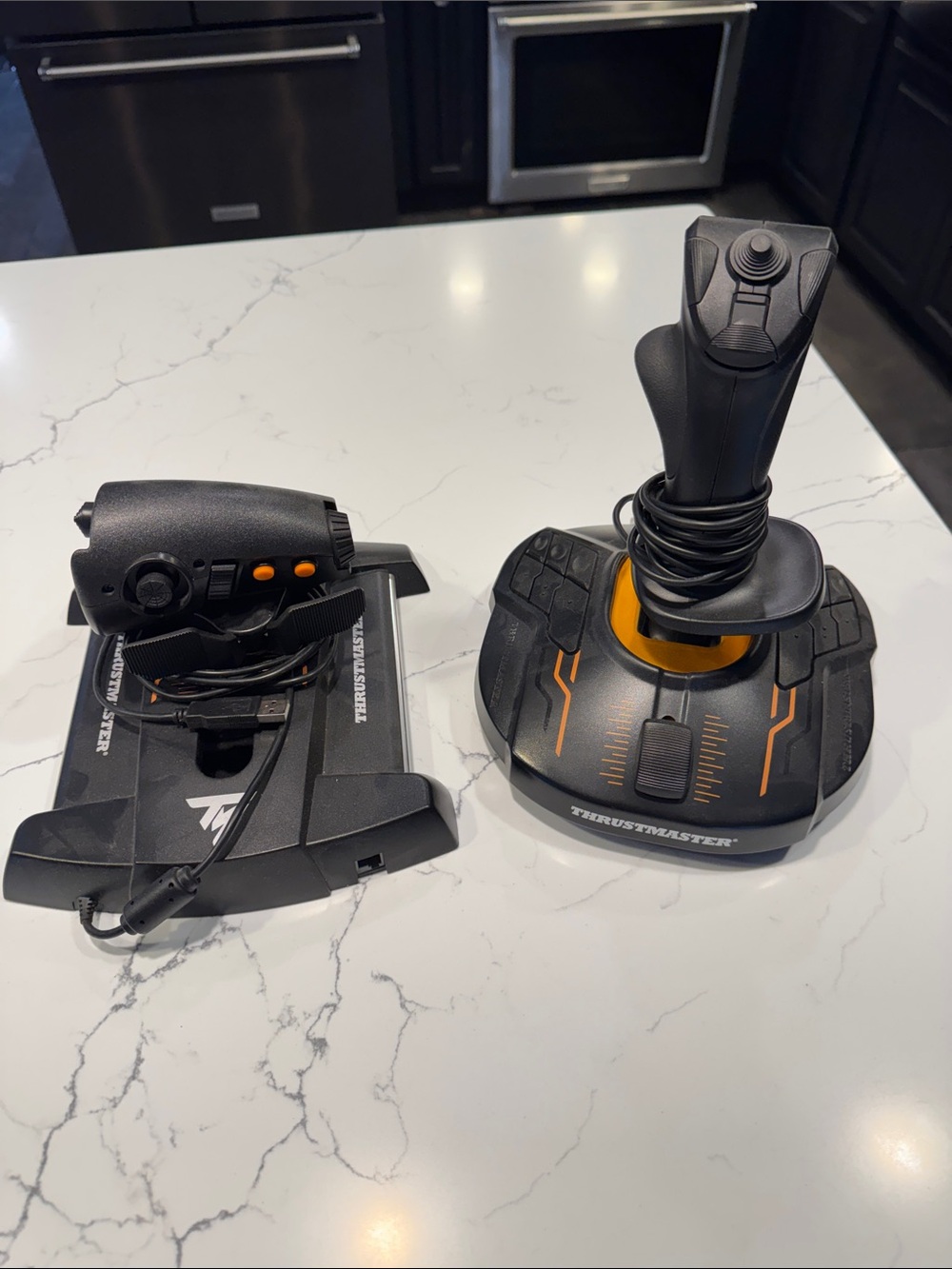 Black and Orange thrustmaster Flight Joystick and Throttle Set